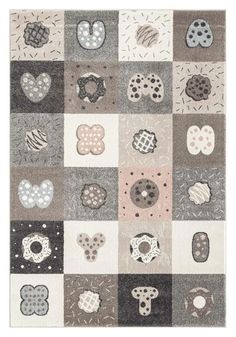 an area rug with various patches and circles on the ground, including one in grey, white