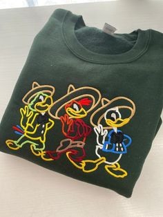 Hoodie Embroidery, Embroider Ideas, Three Caballeros, Disney Epcot, Embroidery Tshirt, Disney Sweatshirts, Embroidered Crewneck, Embroidered Sweatshirt, Embroidered Hoodie