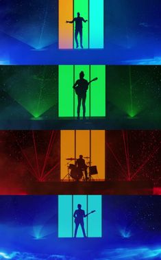 the silhouettes of two people standing on stage in front of bright colored lights and clouds