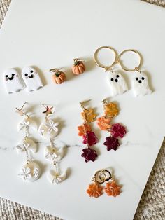 These handmade HALLOWEEN polymer clay earrings are light and the perfect accessory for your ears! Each style is different and all are Halloween or fall themed. The attached pieces are either Cubic Zirconia or gold plated. Earring posts/hooks are all hypoallergenic and nickle/lead free! if any styles that you want are sold out/unavailable, please message me! I can create more! please also message if you are interested in silver options!  All fall styles are made to order. Fall Clay Earrings Diy, Halloween Fall Clay Earrings, Boo Polymer Clay Earrings, Ghost Polymer Clay Earrings, Polymer Clay Ghost Earrings, Halloween Polymer Clay Earrings, Halloween Clay Earrings, Halloween Clay Stud Earrings, Easy Crafts To Sell