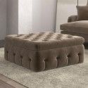 a living room scene with focus on the footstool