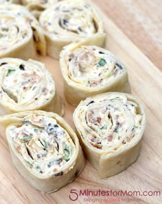 several rolls are arranged on a cutting board