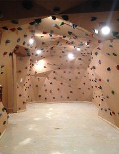 an indoor climbing wall with lots of rocks