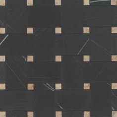 a black and white tile with some brown squares on it