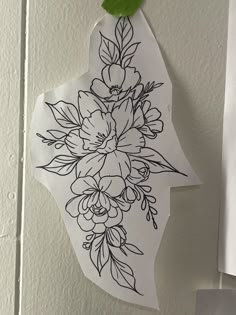 a piece of paper with flowers drawn on it