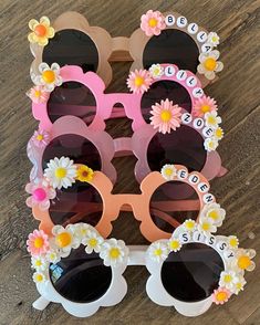 the sunglasses are decorated with flowers and letters