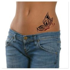 a woman's stomach with an artistic tattoo design on the back of her belly