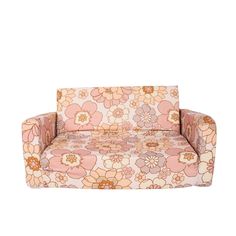 a pink and orange flowered couch on a white background