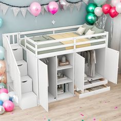 a loft bed with stairs and storage underneath