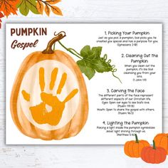 a pumpkin with handprints on it next to some leaves and other autumn decorations