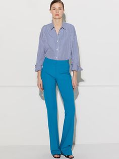 The Danae is the newest pant in the CÂLLAS pant collection. It is a high rise pant with the waistband sitting at the true waist position. It fits slim thru the hips and thighs, and from below the knees, gently flares to the hem. Based on the popular CÂLLAS Jules pant, the Danae has a long and lean flare leg silhouette tailored in a fluid crepe stretch fabric with 4-way stretch. Style, comfort, and versatility come together to create a wardrobe staple. The unique weave of the fabric makes it prac Perfect Pant, New Pant, High Rise Pants, Wrinkle Free, Flare Pants, Slow Fashion, High Waisted Pants, Turquoise Blue, Fit & Flare