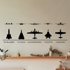 the wall decals show different types of fighter jets