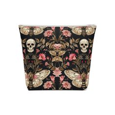 This spooky skull floral moth goth cosmetic bag is perfect for adding a touch of edge to your makeup routine. It's lightweight, durable, and comes in five size options to fit all your cosmetics. The all over print design is ideal for those who love gothic and alternative styles. Product features - Multiple sizes available - Lightweight and compact - Made of 100% cotton drill - Durable plastic zipper closure - All over print design Care instructions - Spot clean with mild soap and water Black Bags With Skull Print For Everyday Use, Black Halloween Bags With Skull Print, Gothic Skull Bag For Everyday Use, Black Halloween Bag With Skull Print, Over Print Design, Halloween Travel, Gothic Skull-shaped Bag With Skull Print, Travel Organizer, Gothic Makeup