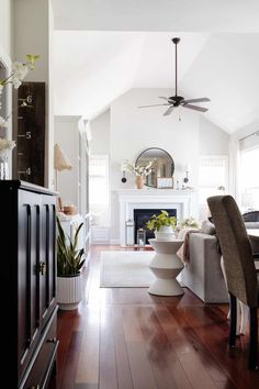 a living room filled with furniture and a fire place