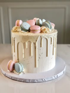 a white cake with macaroni and cheese frosting sitting on top of a table