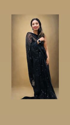 Dazzel like a star in this beautiful party perfect mesmerizing Georgette net saree where elegance meets charm.. Color - A beautiful shade of black Fabric - Magnificent and soft ,elegant net made of Georgette Technique - An interplay of fabric and sequin creating a drape that delicately scintillates and transforms in movement and light. The saree is ready to wear with falls, pico and piping finished in finesse , and unstitched blouse fabric is included. Note: Colors that show up on your screen may vary slightly from the actual product due to variations in settings. Also, the actual product may appear to be different hues depending on the ambience lighting. Since this is a handwoven saree there may be very slight inconsistencies such as in the weave/motifs work, these being characteristics a Semi-stitched Party Wear Saree, Semi-stitched Pre-draped Party Saree, Party Wear Saree With Self Design, Celebration Floor-length Saree With Sheer Dupatta, Traditional Party Wear Saree, Bollywood Style Self Design Saree For Evening, Bollywood Style Self Design Evening Saree, Party Saree With Sheer Dupatta In Georgette, Party Wear Saree With Mirror Work