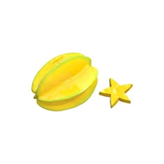 a yellow star shaped object next to a piece of fruit