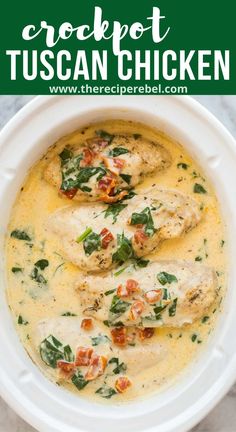 a white bowl filled with chicken and spinach