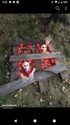 two wooden planks that have skeletons on them and red lights in the middle of them