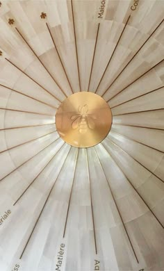 the inside of a white ceiling with gold accents and numbers written in cursive writing