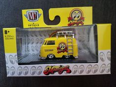 a yellow and white truck in a box