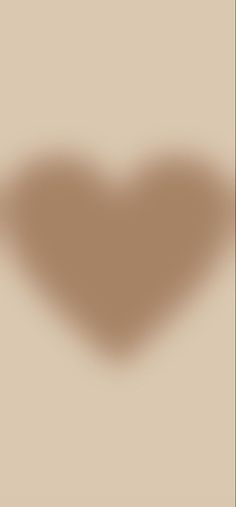 the shadow of a heart on a beige background