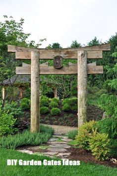 a stone path leading to a wooden structure in the middle of a lush green garden