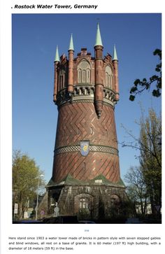 an old brick tower with green spires on the top and blue sky above it