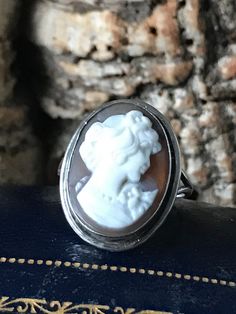 A traditional Silver vintage bezel set Cameo ring, oval Cameo 18mm x 13mm  , plain polished border with an overall size of 21 x 16mm , I believe it's marked 800 silver , Size J or US 4.5 Classic White Oval Signet Ring, Classic Oval White Signet Ring, Victorian Style Silver Oval Signet Ring, Silver Oval Victorian Style Signet Ring, Silver Oval Victorian Signet Ring, Antique Silver Oval Signet Ring, Antique Oval Sterling Silver Signet Ring, White Oval Heirloom Signet Ring, Classic White Oval Cabochon Ring