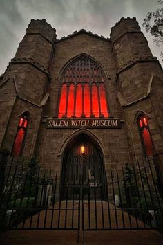 the salem witch museum is lit up in red for halloween season, and it's an amazing place to visit