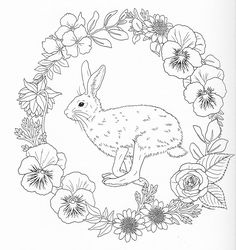 a black and white drawing of a rabbit surrounded by flowers in a circle with leaves