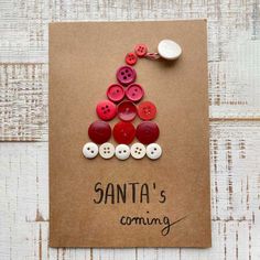 a christmas tree made out of buttons on top of a brown card with the words santa's coming