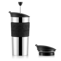 a stainless steel coffee cup next to a black lid