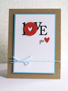 a card with the words love you written in red and black on top of it