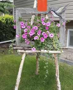 an old chair with flowers growing out of it