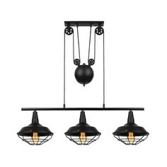 three black pendant lights hanging from the ceiling