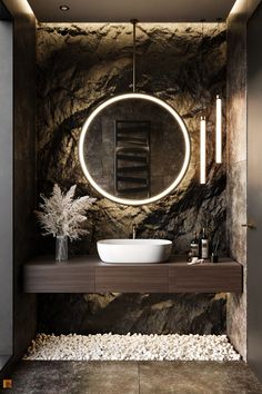 a bathroom with a round mirror above the sink