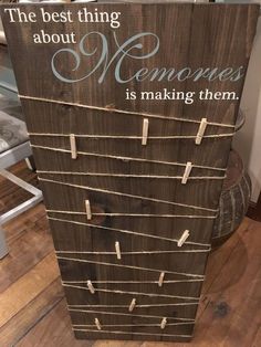 a sign that says the best thing about memories is making them with clothes pins attached to it