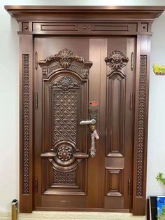 an ornate wooden door with decorative carvings on it's sides and sidelights above the doors