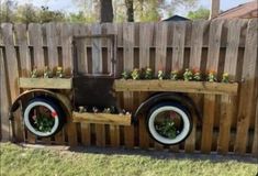 an old truck planter made out of wooden pallets