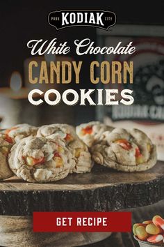 white chocolate candy corn cookies on a wooden platter with the words get recipe written below