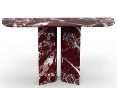 a red marbled table with two columns on each side and one column at the end