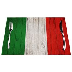 a place mat with a fork and knife on it in the colors of italy's flag