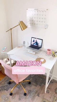 a white desk with a laptop on it and a pink chair in front of it