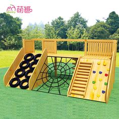 a children's wooden play set in the grass