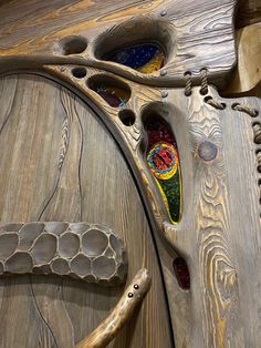 an intricate wooden door with stained glass inlays