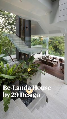 the interior of a modern house with stairs and plants