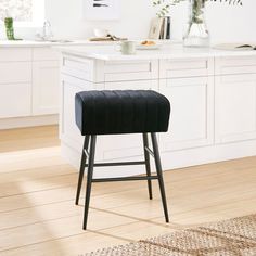 a black bar stool in a white kitchen