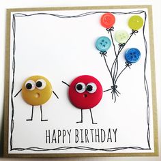 two buttons are attached to a card with the words happy birthday