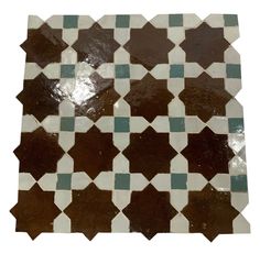 a tile floor with brown and blue squares on it